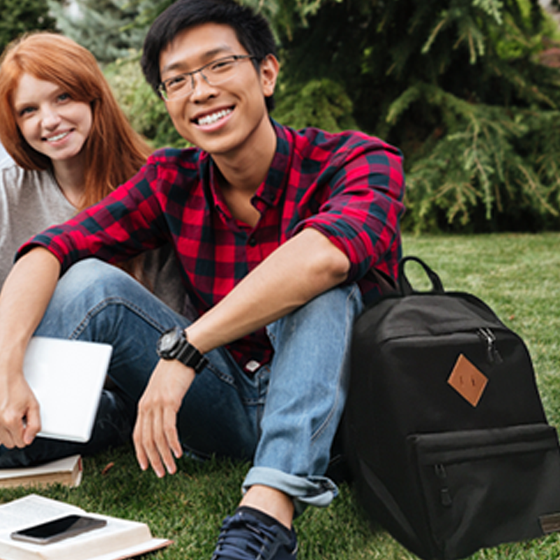 College kids sitting with backpack